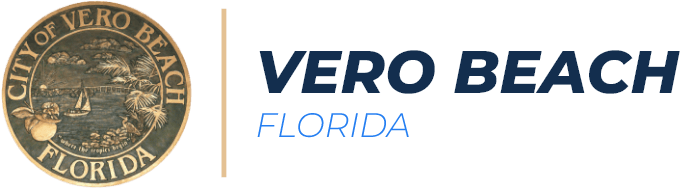 Circle seal of the City of Vero Beach, Florida, with a coastal scene and palm trees, next to the text 'VERO BEACH FLORIDA' separated by a vertical divider.